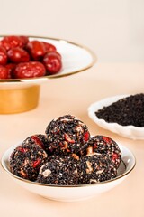 Black sesame balls walnut candies, round and square candies, healthy breakfast, delicious snack