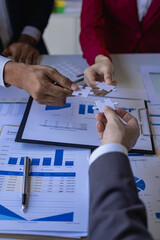 Business team meeting using calculator Working with laptop and charts and analyzing business strategy Financial statistics sitting at the table in the financial office in vertical view