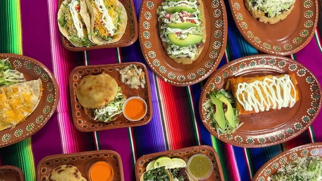 Group of Mexican food dishes on table