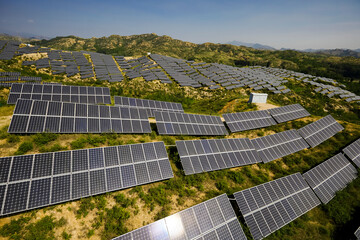 Aerial photography of solar photovoltaic cells built on a hillside