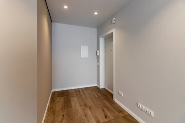 The interior of an empty modern apartment in bright colors immediately after renovation