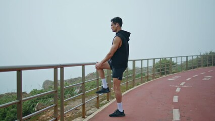 Morning athlete prepare running in city park. Strong runner training outdoors