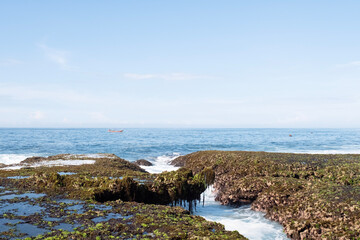 Sawarna beach,west Java,Indonesia, beautiful beach with coral reefs dotted with greenery 