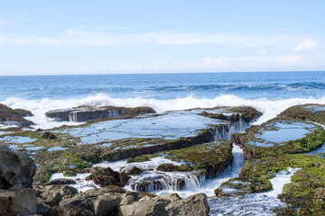 Obraz premium Sawarna beach,west Java,Indonesia, beautiful beach with coral reefs dotted with greenery 