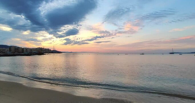 Sunrise at "La Favi&egrave;re" beach with "Port de Bormes" marina in the left, Bormes-les-Mimosas, France