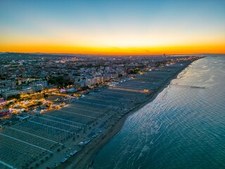 Beautiful sunset on the sea coast as seen from a drone. Italian famous seaside resort as seen from...
