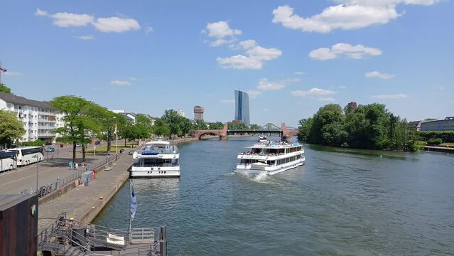 Cruise ships take tourist on the Main river, Frankfurt city, Germany. Taken from Eiserner Steg or Iron Footbridge.