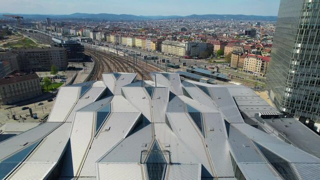 vienna skyline from train station, railroads, Wien hauptbahnhof, flying drone shot; vienna city architecture, blue sky and great weather.