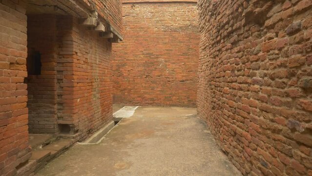 Inside the lanes of a ruined monastery with intricate brick masonry work which was excavated at the site of Nalanda Mahavihara an ancient Buddhist Monastic University in Bihar, India