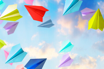 colorful paper plane in the sky. Concept of dream, goal achievement, freedom, travel, education,...