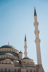 Fototapeta na wymiar Ankara Kocatepe Mosque minaret silhouette from below with blue sky 
