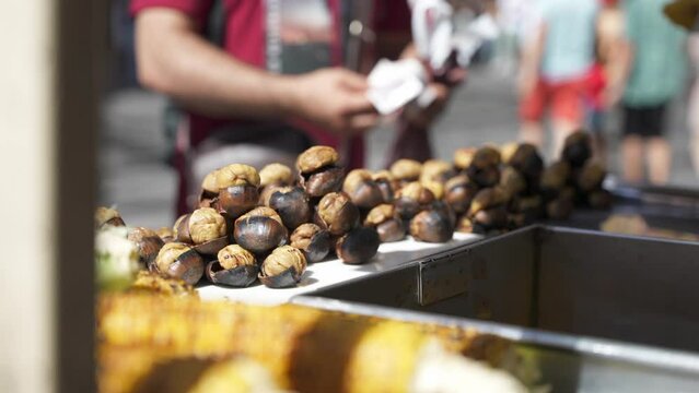 People buy famous turkey roasted chestnut In the cart on Istiklal Avenue. Popular street food in Istanbul