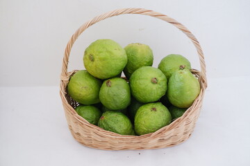 guava fruit in basket on white background