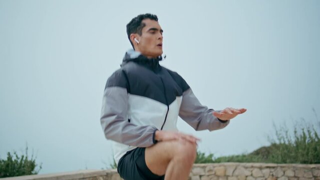 Fitness male practice sport exercise closeup. Serious strong athlete jump high