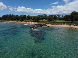 Aerial drone footage of the island of Maui in Hawaii showing the beach and mountains