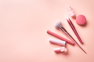 Set of decorative cosmetics on pink background