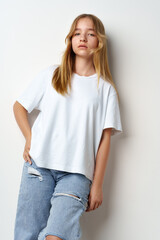 Portrait of young beautiful cute teen girl posing at camera