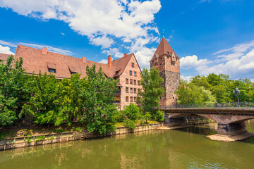 View of Nuremberg Old Town featuring the River Pegnitz, Heubrücke, Schuldturm and other old buildings.
