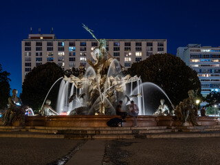 Fountain in Berlin at night. The fountain is illuminated by night lights.
