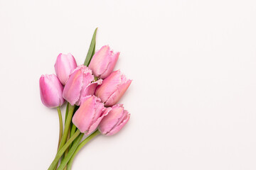 Bouquet of pink tulip flowers on a gray background. Copy space.