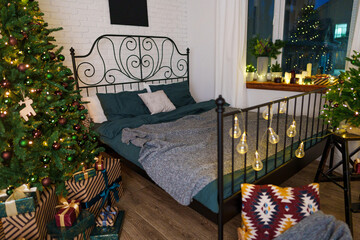 Cozy bedroom interior with winter Christmas decorations