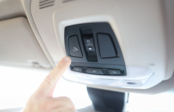 Man finger pressing sos emergency button to contact call center. Help after a car accident