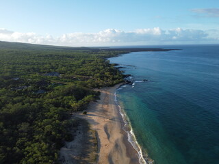 Aerial drone footage of the island of Maui in Hawaii showing the beach and mountains