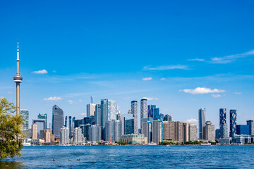 Toronto downtown skyline seen acrtoss the water from the toronto islands in summer time room for text