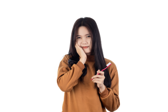 Young Asian woman have a toothache holding toothbrush isolated on white background with clipping path. Health and illness concept.