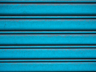 Close up shot of Old Steel shutter door, metal door background and textured , blue color