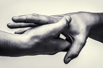 Close up help hand. Two hands, helping arm friend, teamwork. Helping hand concept and international...