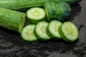 cucumber. Fresh cucumber slices on the black background, cucumber slices close up.