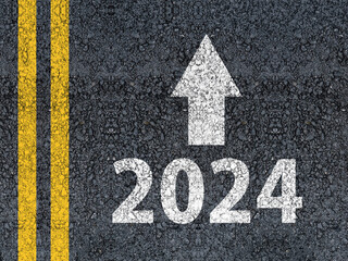 happy new year 2024 Year 2024 and an arrow written on an asphalt road
