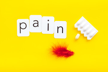 Pharmacy concept. Word pain with red pen and rectal suppositories