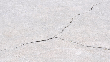 Obraz premium Crack line texture on surface of concrete pavement floor background