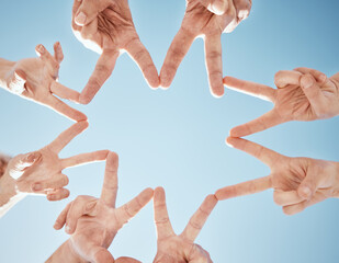 Hands, star and blue sky, support and solidarity with team huddle, community and V sign with...
