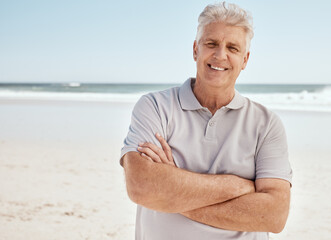 Beach portrait, arms crossed and senior man relax with summer sunshine, nature freedom or travel...