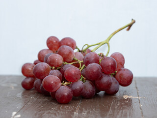 grapes on a brown wooden table