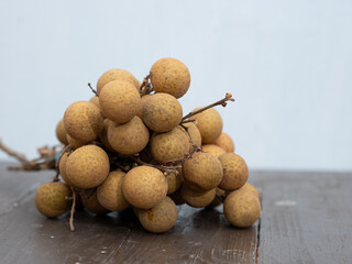 Dimocarpus longan lour longan fruit on brown wooden table