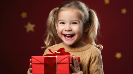 Fototapeta na wymiar Happy smiling girl holding gift box on a colored background