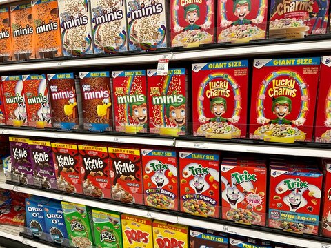 Various boxes of breakfast cereals on a store shelf 
