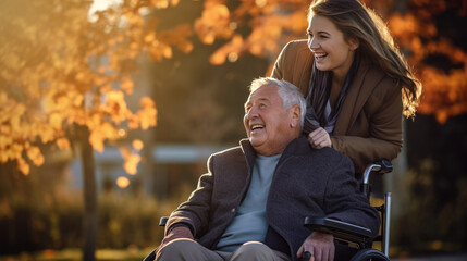 Senior man in wheelchair with his daughter in autumn park