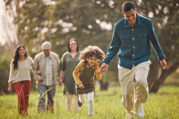 Family, park and parents with children in nature for playing, bonding and running together in...