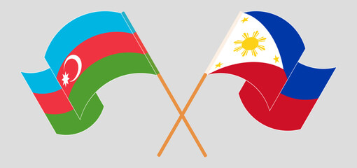 Crossed and waving flags of Azerbaijan and the Philippines
