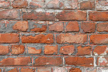 Obraz premium Old brick wall, old texture of red stone blocks closeup Background