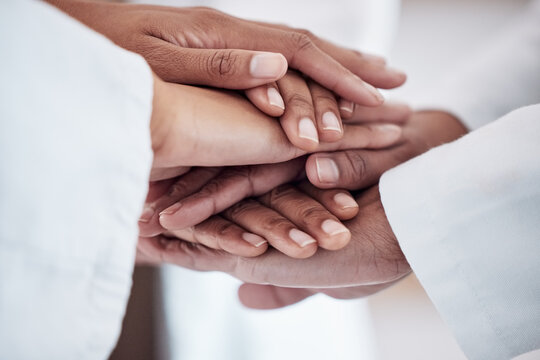 Medical, collaboration and hands together in circle for team, unity and motivation at a hospital. Doctors, diversity and healthcare employees in a huddle for solidarity, help and support in medicine.
