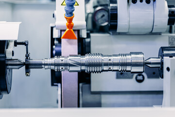 Macro Machine iron tools CNC cut of metal with light spark, technology modern industrial