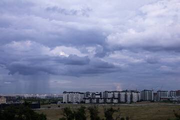 Atmosphere of overcast dusk sky before to rainy over the land and building. Natural stormy sky weather background