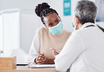 Face mask, help or doctor consulting a patient in meeting in hospital writing history or healthcare record. People, medical or nurse with black woman talking or speaking of test results or advice