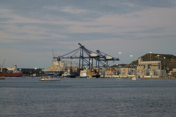 Santa Marta, Colombia - December 30 2022: Beautiful Harbor view with container ships in port of Santa Marta in Colombia